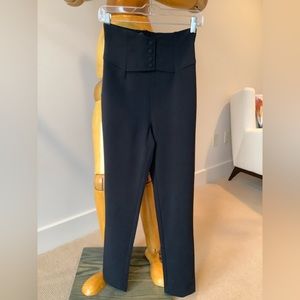 High waisted black tapered sized 4 trousers w fun front detailing.